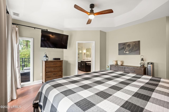 8 Wild Magnolia Ln, Okatie, SC 29909 - bedroom with access to outside, ensuite bath, visible vents, a tray ceiling, and light wood finished floors