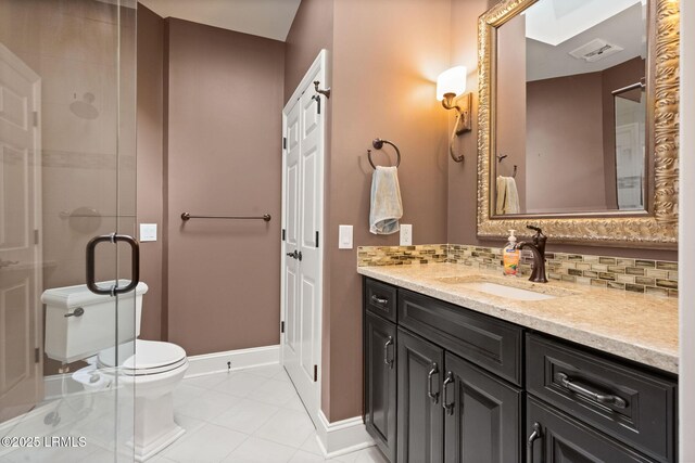 8 Wild Magnolia Ln, Okatie, SC 29909 - bathroom featuring vanity, tile patterned flooring, backsplash, toilet, and a shower stall