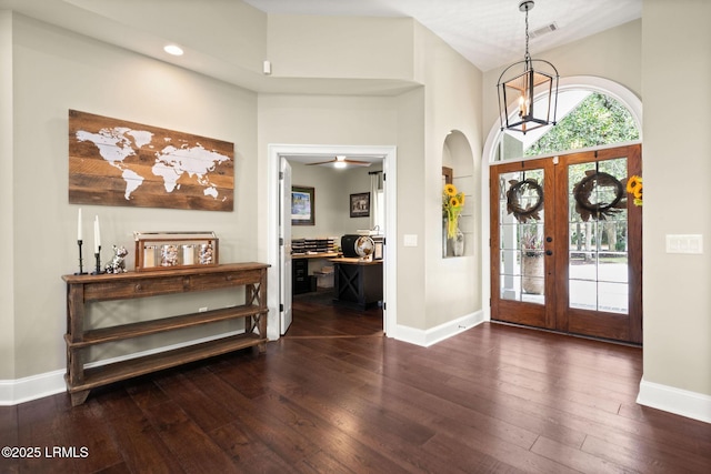 8 Wild Magnolia Ln, Okatie, SC 29909 - entrance foyer with arched walkways, a high ceiling, dark wood-style flooring, french doors, and baseboards