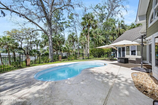 8 Wild Magnolia Ln, Okatie, SC 29909 - view of swimming pool featuring outdoor lounge area, a patio area, a fenced in pool, and fence