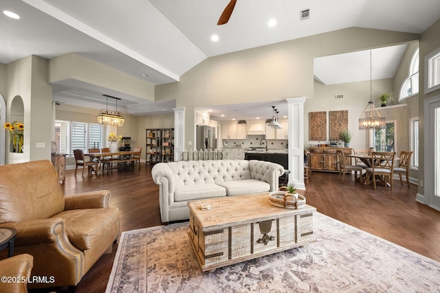 8 Wild Magnolia Ln, Okatie, SC 29909 - living area featuring ornate columns, visible vents, ceiling fan with notable chandelier, and dark wood finished floors