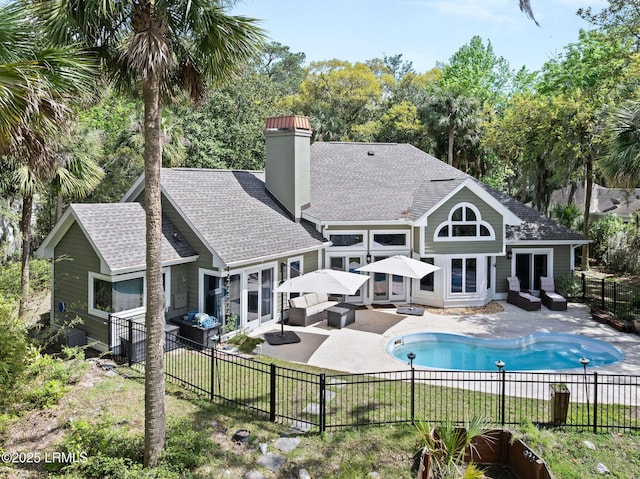 8 Wild Magnolia Ln, Okatie, SC 29909 - rear view of house featuring outdoor lounge area, a patio, and a fenced backyard