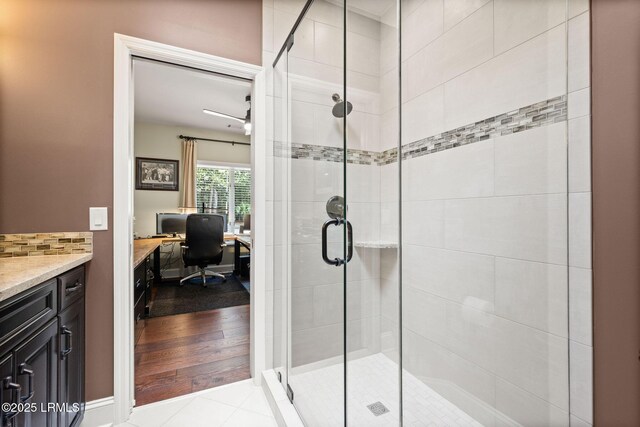 8 Wild Magnolia Ln, Okatie, SC 29909 - bathroom featuring tile patterned flooring, vanity, backsplash, and a stall shower