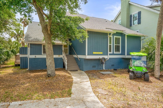 26 Fairway Club Dr, Fripp Island, SC 29920 - view of front of house with roof with shingles and crawl space