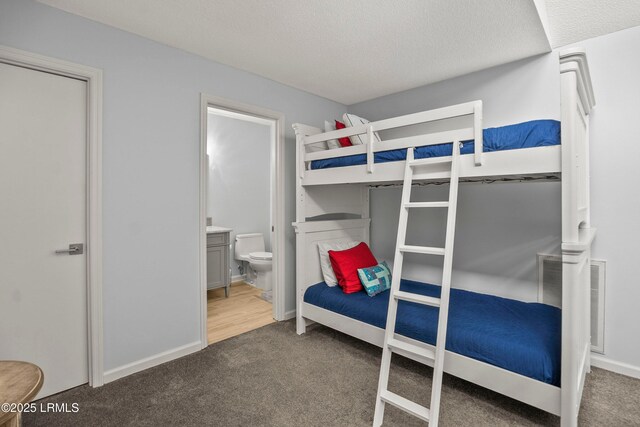 26 Fairway Club Dr, Fripp Island, SC 29920 - bedroom with carpet floors, a textured ceiling, and ensuite bath