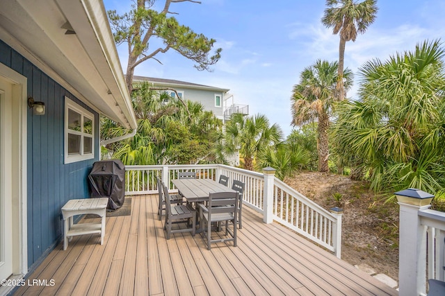 26 Fairway Club Dr, Fripp Island, SC 29920 - wooden deck with outdoor dining space and a grill