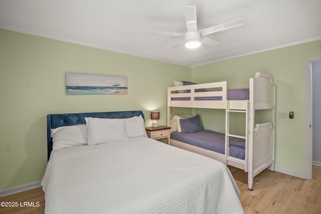 26 Fairway Club Dr, Fripp Island, SC 29920 - bedroom featuring crown molding, baseboards, a ceiling fan, and light wood-type flooring