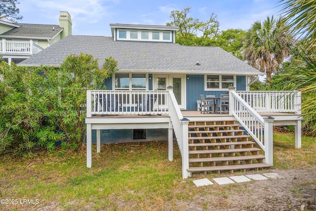 26 Fairway Club Dr, Fripp Island, SC 29920 - view of front of home featuring a shingled roof and stairway