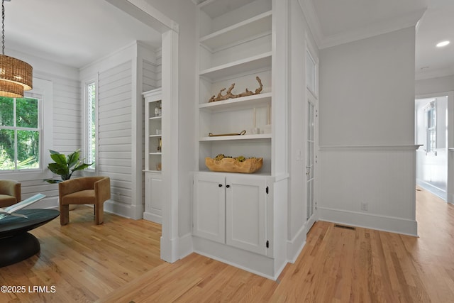 12 Sheffield Ct, Beaufort, SC 29907 - sitting room featuring light wood-style floors, crown molding, plenty of natural light, and a chandelier