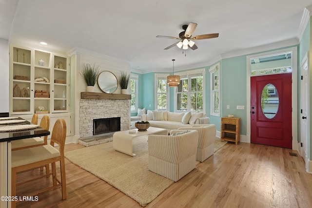 12 Sheffield Ct, Beaufort, SC 29907 - living room featuring ceiling fan, light wood finished floors, ornamental molding, baseboards, and a fireplace