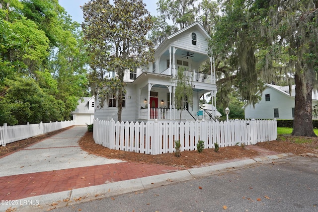 12 Sheffield Ct, Beaufort, SC 29907 - view of front facade featuring a porch, a balcony, a ceiling fan, a fenced front yard, and a garage