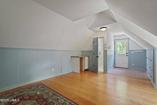12 Sheffield Ct, Beaufort, SC 29907 - bonus room featuring light wood-style flooring, a wainscoted wall, and vaulted ceiling