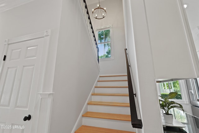 12 Sheffield Ct, Beaufort, SC 29907 - staircase featuring plenty of natural light, a chandelier, and baseboards