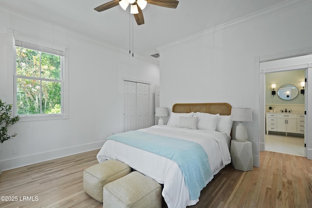 12 Sheffield Ct, Beaufort, SC 29907 - bedroom with crown molding, light wood-style flooring, ensuite bath, ceiling fan, and a closet