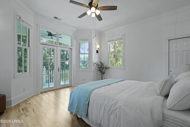 12 Sheffield Ct, Beaufort, SC 29907 - bedroom with access to exterior, french doors, multiple windows, wood finished floors, and crown molding