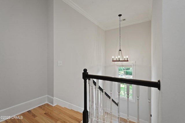 12 Sheffield Ct, Beaufort, SC 29907 - stairway featuring crown molding, wood finished floors, a chandelier, and baseboards
