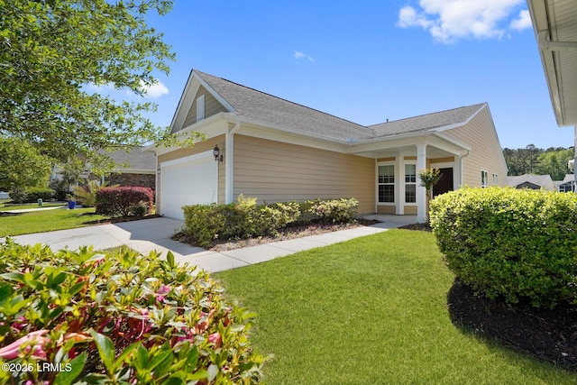 95 Sunrise Point Dr, Okatie, SC 29909 - view of side of home featuring a lawn, a garage, a shingled roof, and concrete driveway