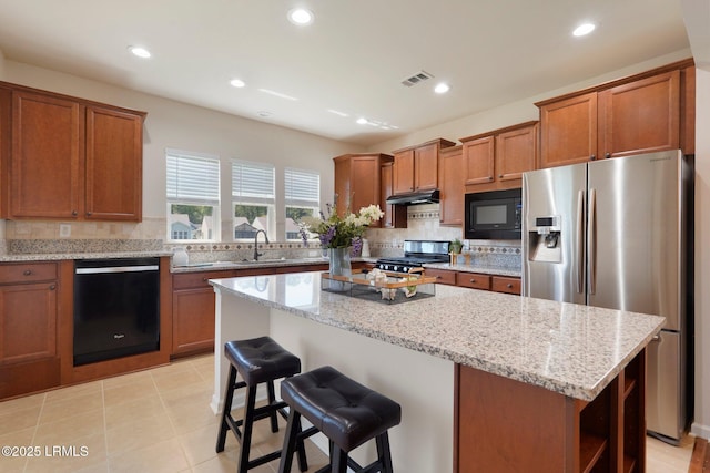 95 Sunrise Point Dr, Okatie, SC 29909 - kitchen featuring black appliances, brown cabinets, open shelves, backsplash, and recessed lighting
