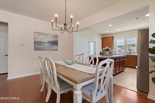 95 Sunrise Point Dr, Okatie, SC 29909 - dining area with a chandelier, wood-type flooring, recessed lighting, and baseboards