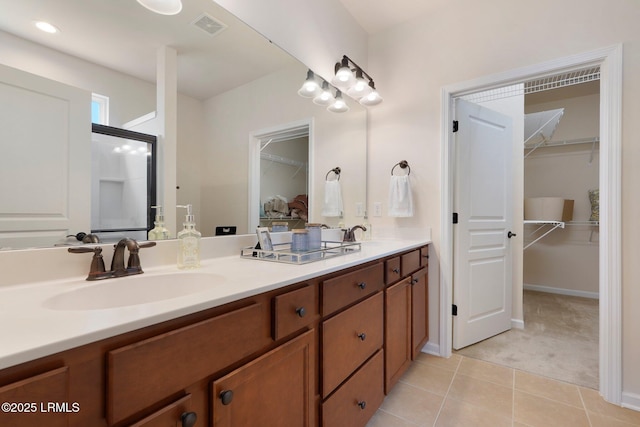 95 Sunrise Point Dr, Okatie, SC 29909 - full bathroom featuring double vanity, a walk in closet, and tile patterned floors