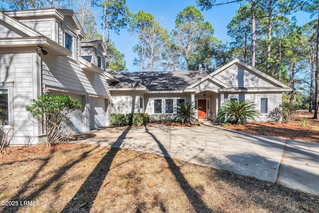 view of front of home featuring a garage and driveway