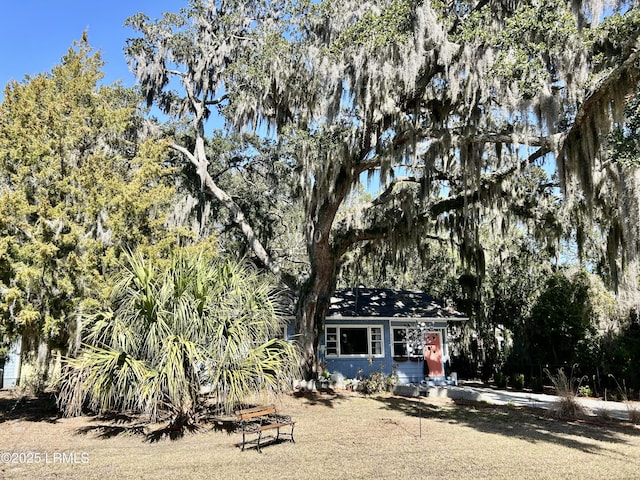 view of property hidden behind natural elements