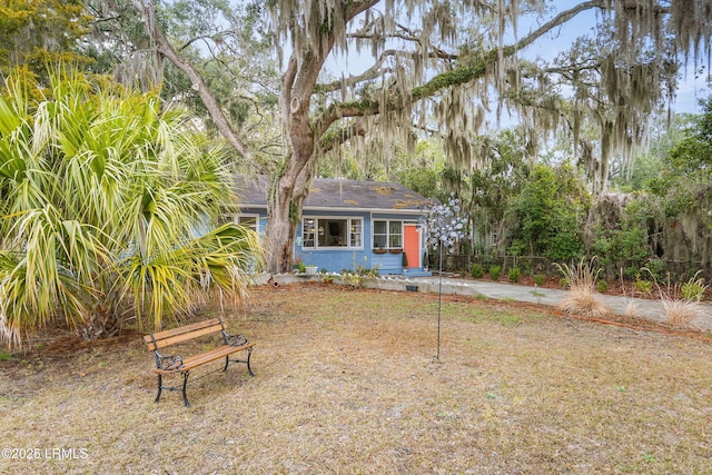 view of front of property featuring fence