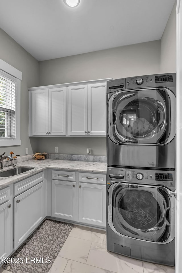 39 Sweet Marsh Ct, Bluffton, SC 29910 - washroom featuring stacked washing machine and dryer, cabinet space, and light marble finish flooring