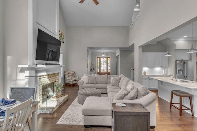 39 Sweet Marsh Ct, Bluffton, SC 29910 - living area featuring ceiling fan, dark wood-style floors, a fireplace, and a high ceiling