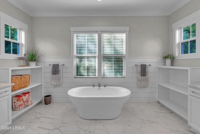 39 Sweet Marsh Ct, Bluffton, SC 29910 - bathroom featuring marble finish flooring, a soaking tub, healthy amount of natural light, wainscoting, and vanity