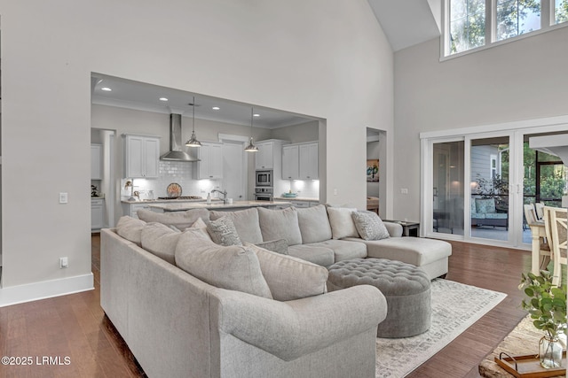 39 Sweet Marsh Ct, Bluffton, SC 29910 - living area with plenty of natural light, high vaulted ceiling, dark wood finished floors, crown molding, and recessed lighting