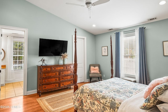 bedroom featuring baseboards, visible vents, vaulted ceiling, light wood-type flooring, and recessed lighting