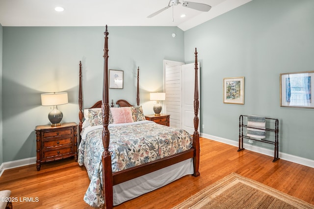 bedroom with lofted ceiling, baseboards, wood finished floors, and recessed lighting