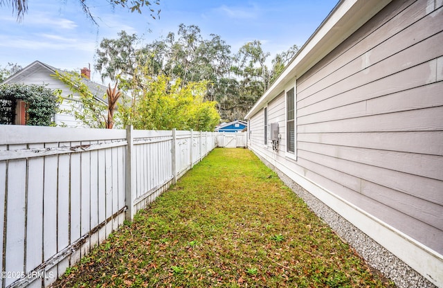 view of yard with a fenced backyard