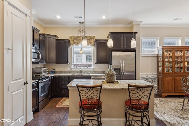 303 Hampton Lake Xing, Bluffton, SC 29910 - kitchen featuring stainless steel appliances, a sink, dark brown cabinetry, dark wood-style flooring, and crown molding
