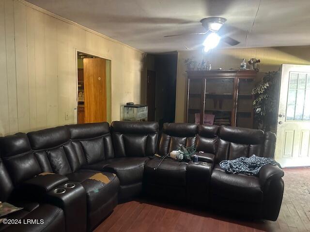 home theater with wood-type flooring and ceiling fan