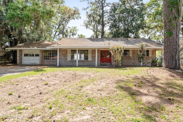 3008 Broad River Dr, Beaufort, SC 29906 - ranch-style home with a garage, driveway, and brick siding