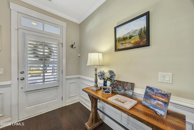 foyer featuring ornamental molding and dark hardwood / wood-style floors