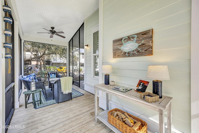 sunroom with vaulted ceiling and ceiling fan