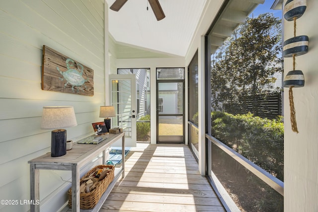 sunroom / solarium featuring vaulted ceiling and ceiling fan