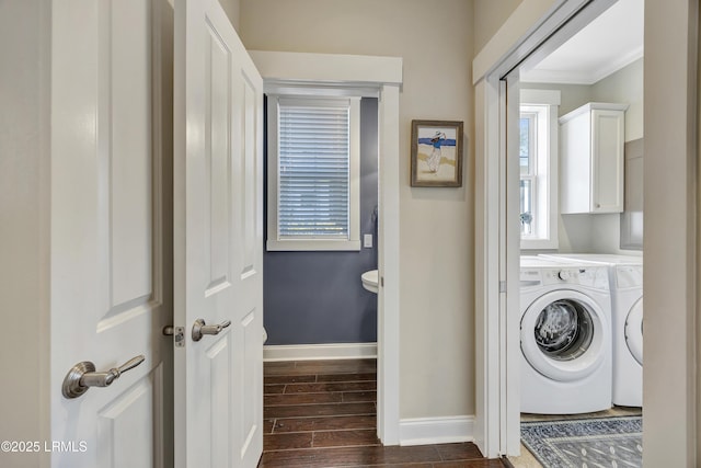 clothes washing area featuring cabinets and ornamental molding