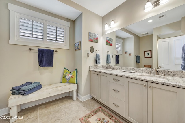 bathroom with vanity and tile patterned floors