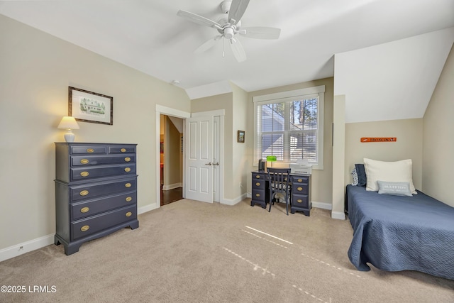 carpeted bedroom with vaulted ceiling and ceiling fan