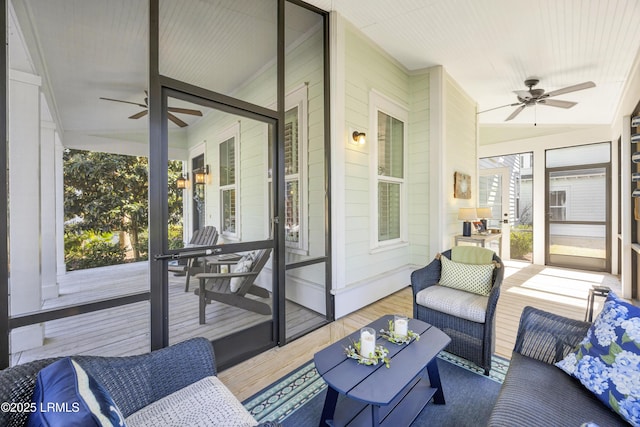 sunroom with plenty of natural light, ceiling fan, and vaulted ceiling