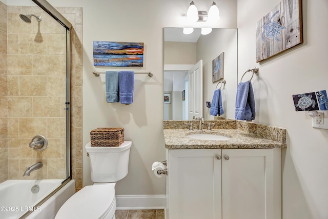 full bathroom featuring vanity, enclosed tub / shower combo, and toilet