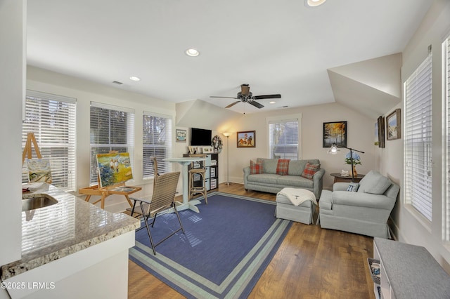 living room with sink, dark wood-type flooring, and ceiling fan