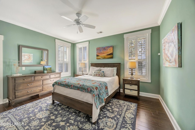 bedroom with dark wood-type flooring, ceiling fan, ornamental molding, and multiple windows