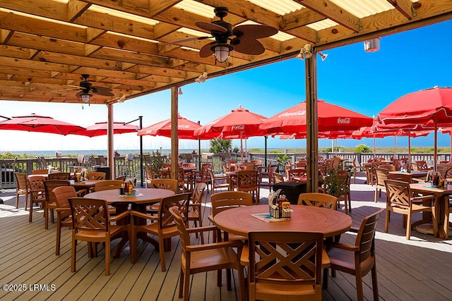 wooden terrace featuring ceiling fan