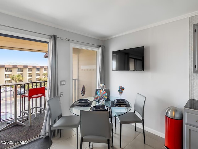 dining space with crown molding