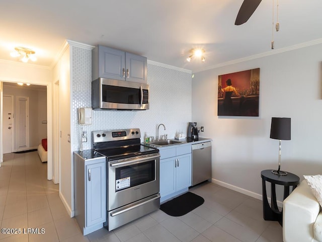 kitchen with sink, light tile patterned floors, ornamental molding, and stainless steel appliances